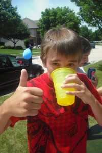 Alex slurps lemonade made my neighborhood boys and sold for 25 cents a cup. The boys donated some of their quarters to the ministry. You go, guys!