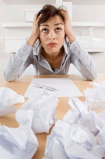 frustrated-woman-with-crumpled-paper
